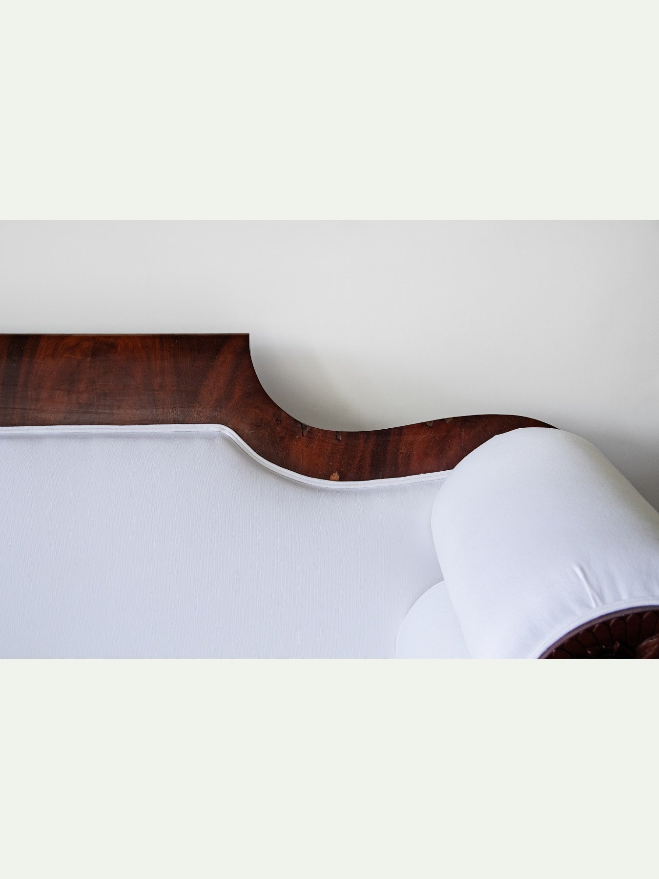 Antique Carved Mahogany Sofa with Crisp White Upholstery