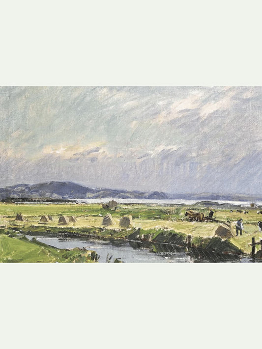 pastoral landscape with haystacks and grazing cattle