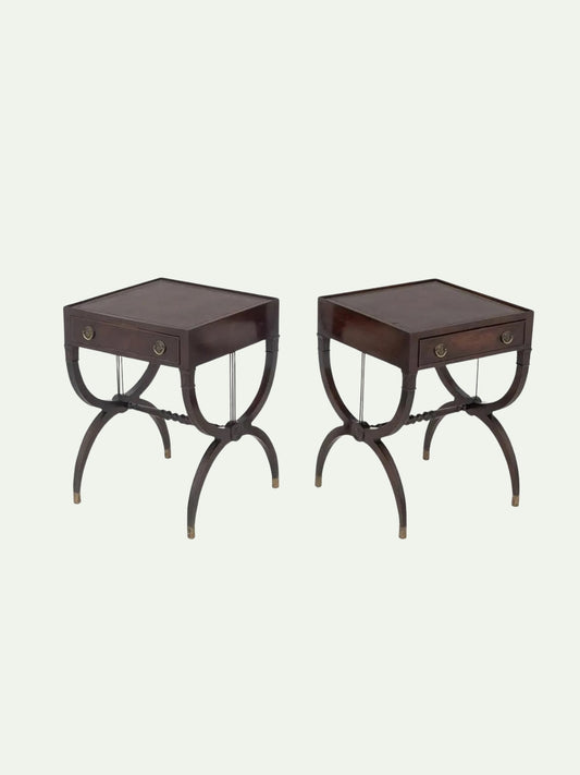 A pair of dark brown wooden end tables with single drawers, curved legs, and brass pull knobs, shown against a light off-white background.