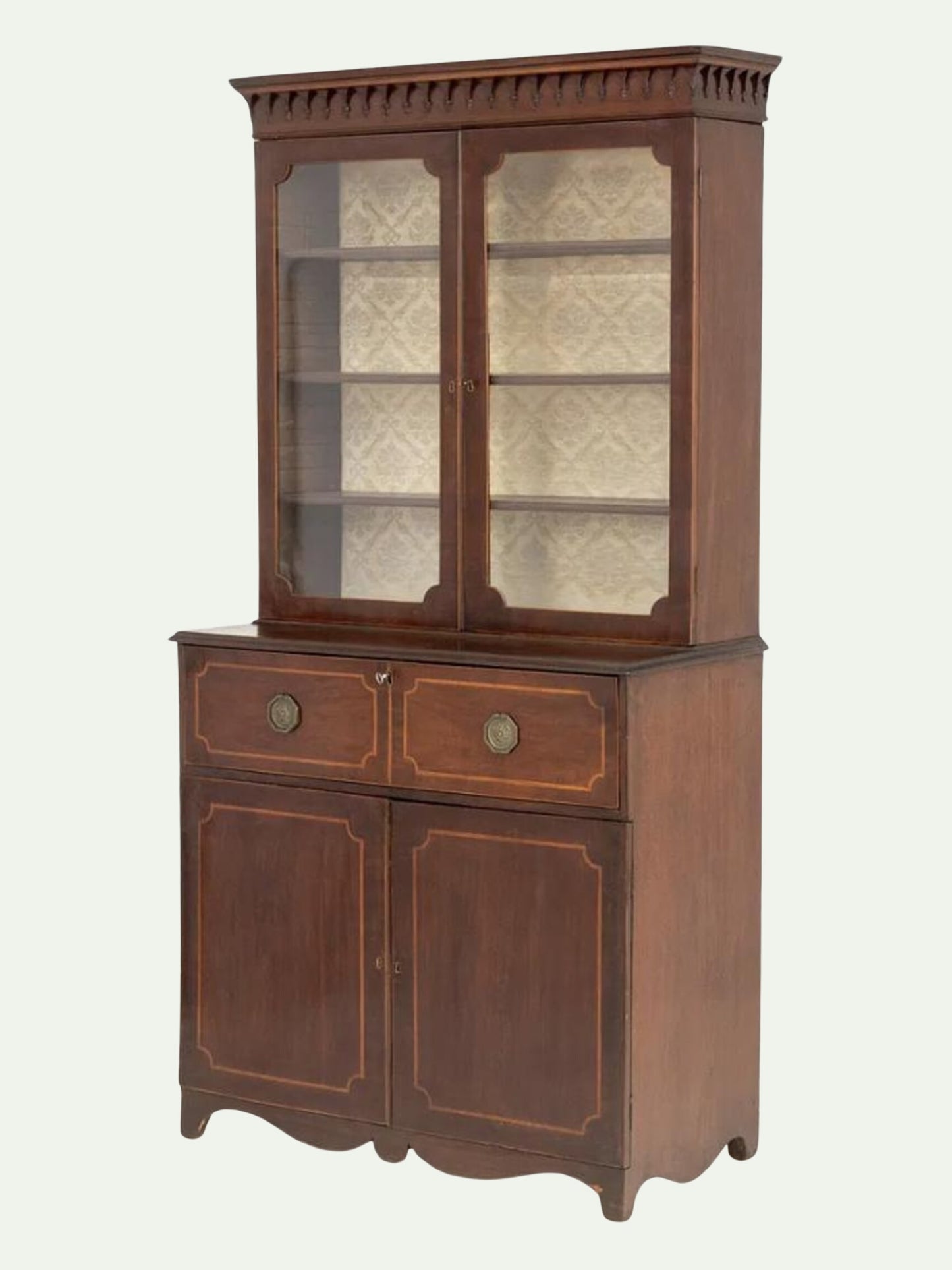 A vintage dark brown wooden hutch cabinet with a glass-front upper display cabinet, two drawers with round brass knobs, and two lower cabinet doors with decorative gold-toned inlay, shown against a plain off-white background.