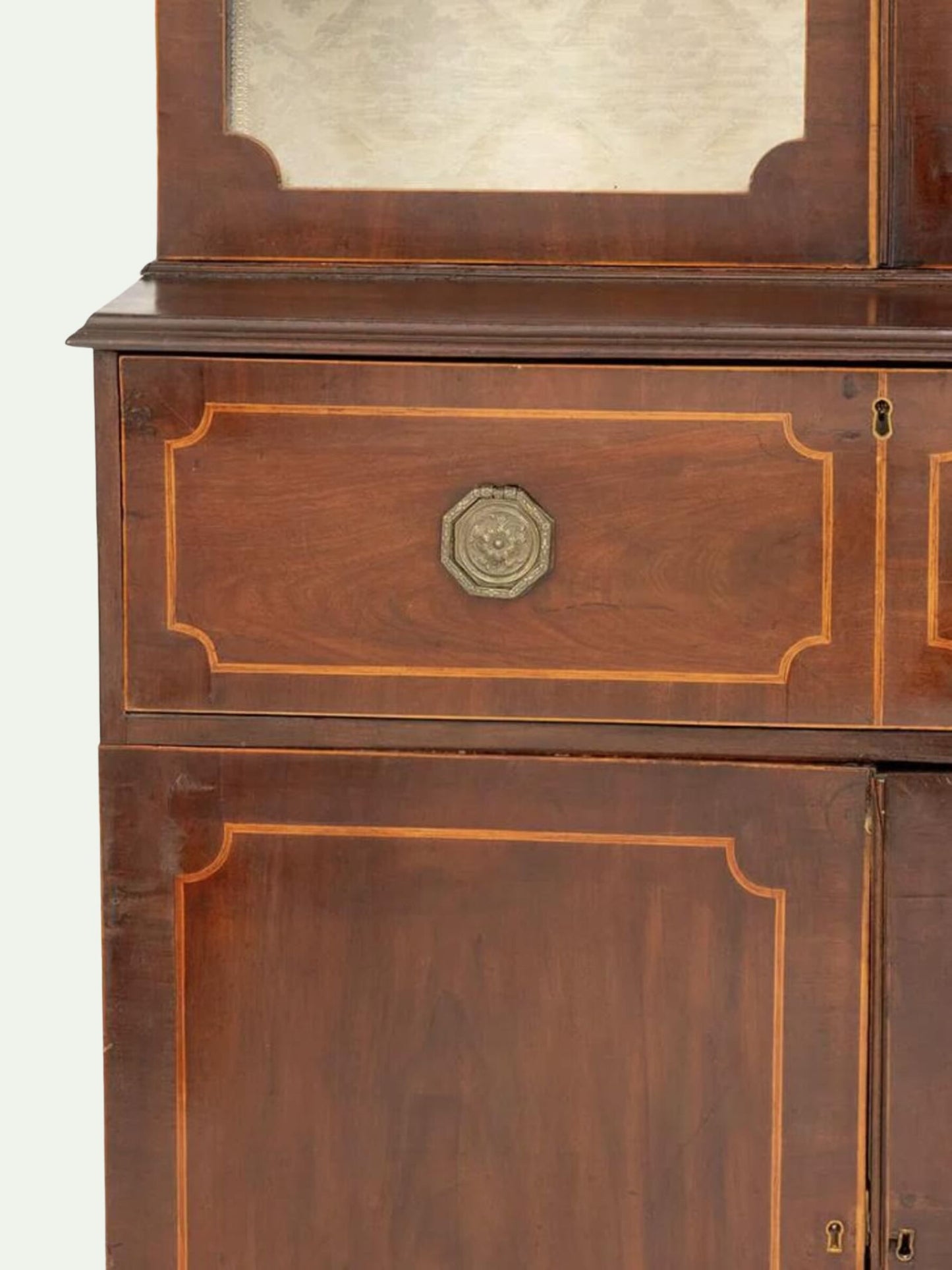 close-up of ornate drawers on a wooden mahogany secretary bookcase
