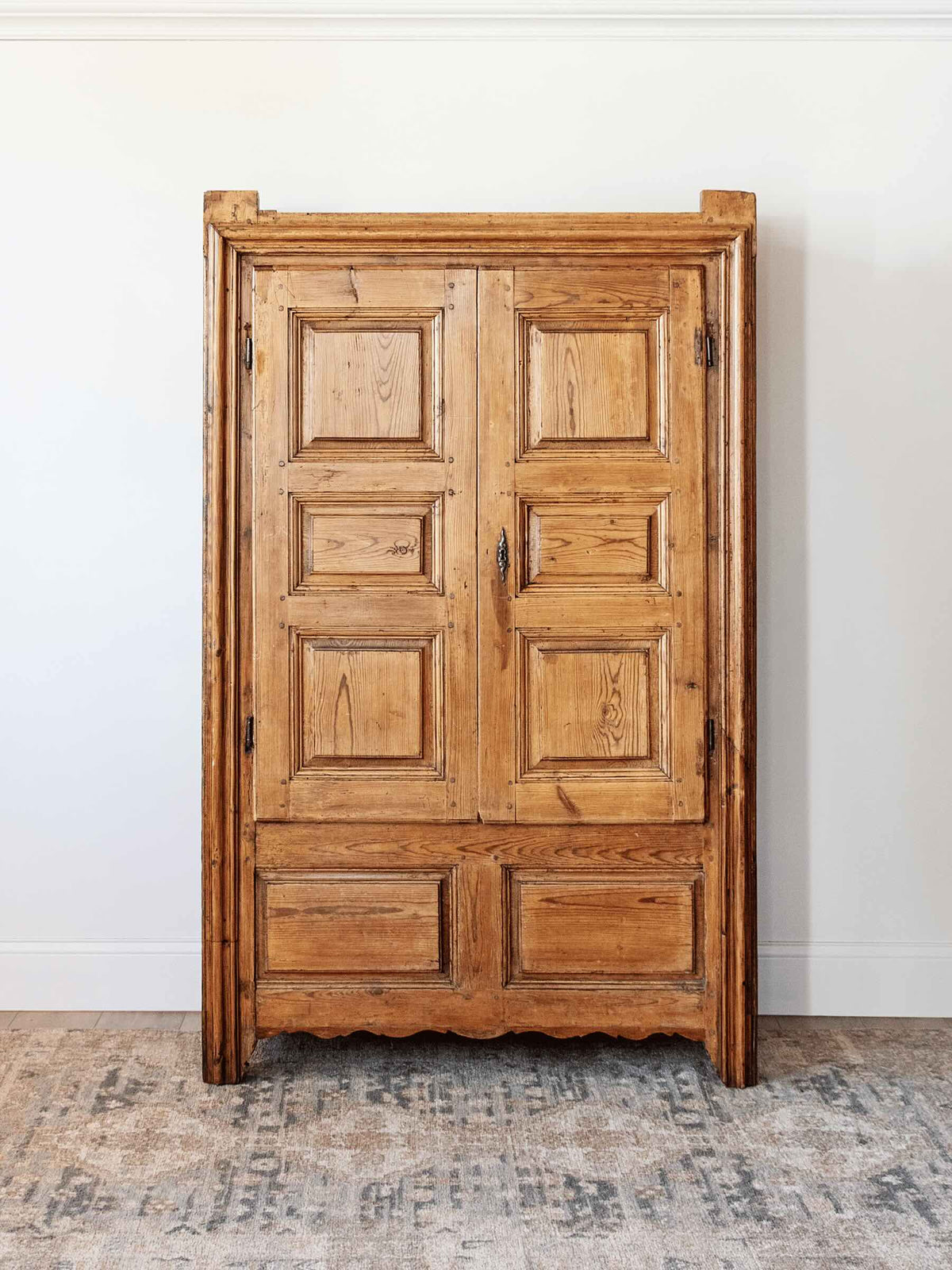 antique European country pine armoire with paneled doors lift top storage