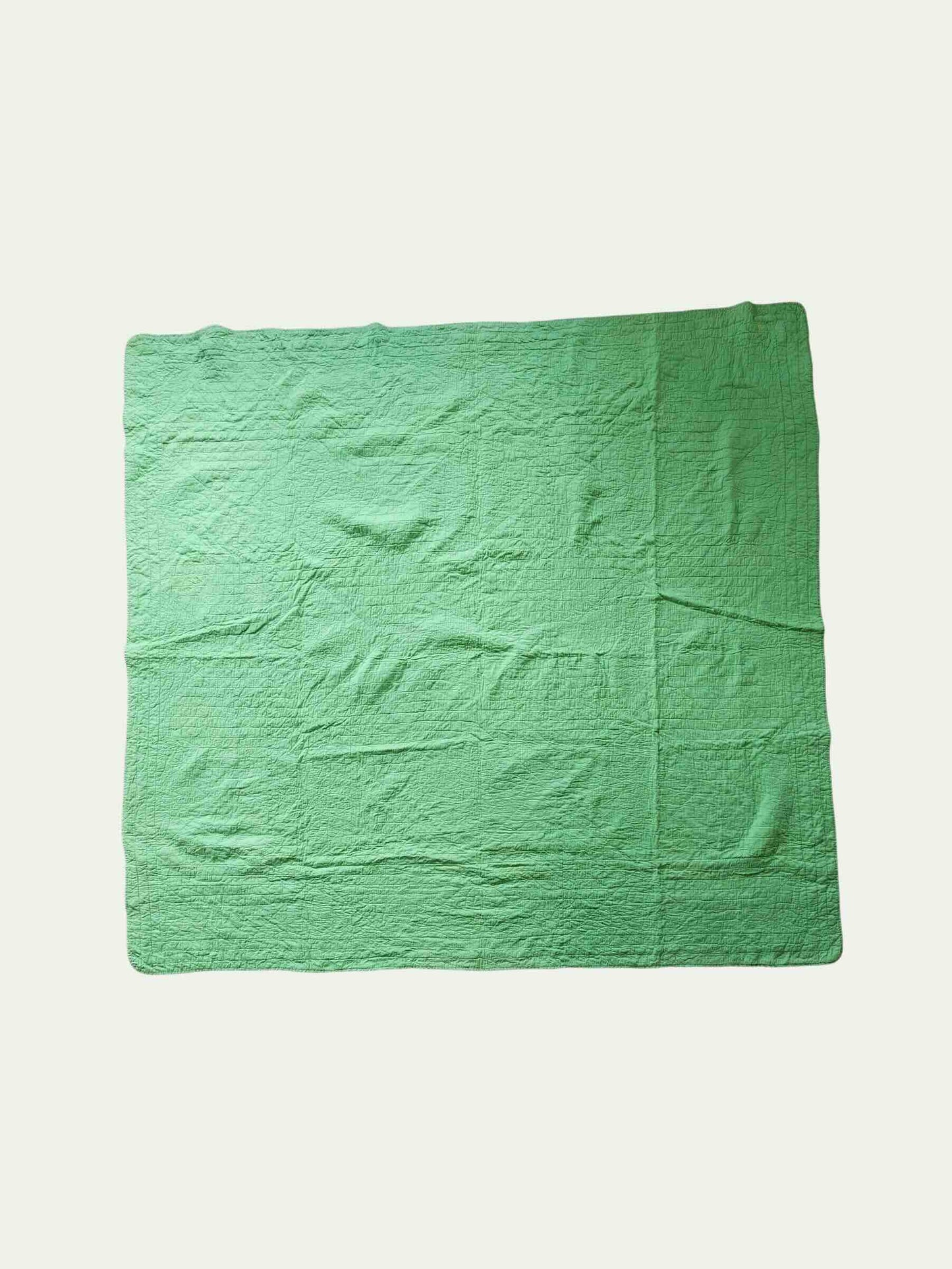 Green fabric on a light gray background