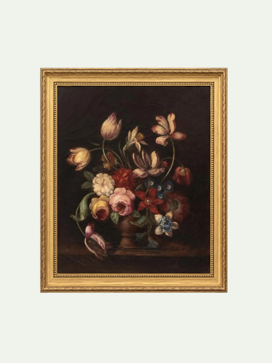 A framed still life painting featuring a bouquet of flowers in a vase against a dark background, enclosed in an ornate gold frame on a light gray background.