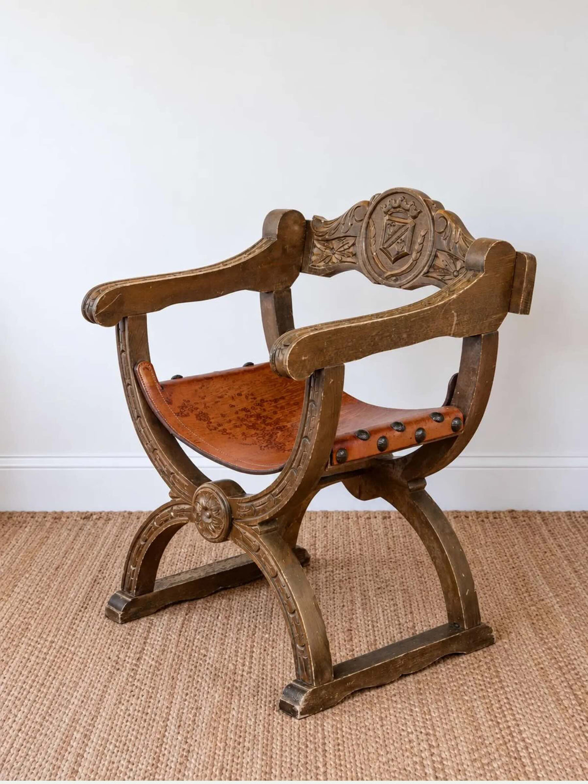 Antique Spanish Renaissance Revival Dante Chair with Carved Heraldic Crest & Leather Sling Seat