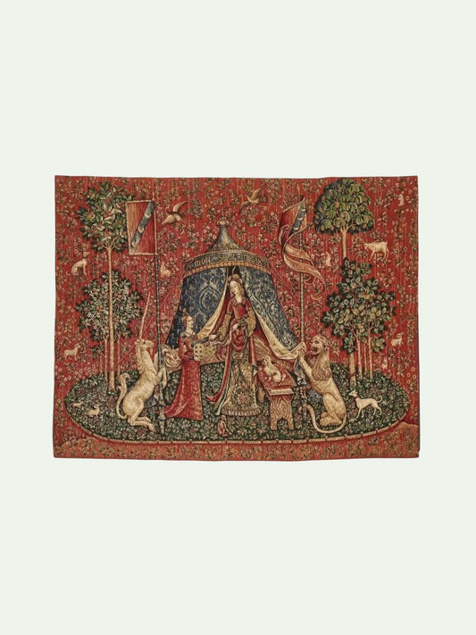 Decorative tapestry with a central scene of a person under a canopy, flanked by lions and trees on a red background.