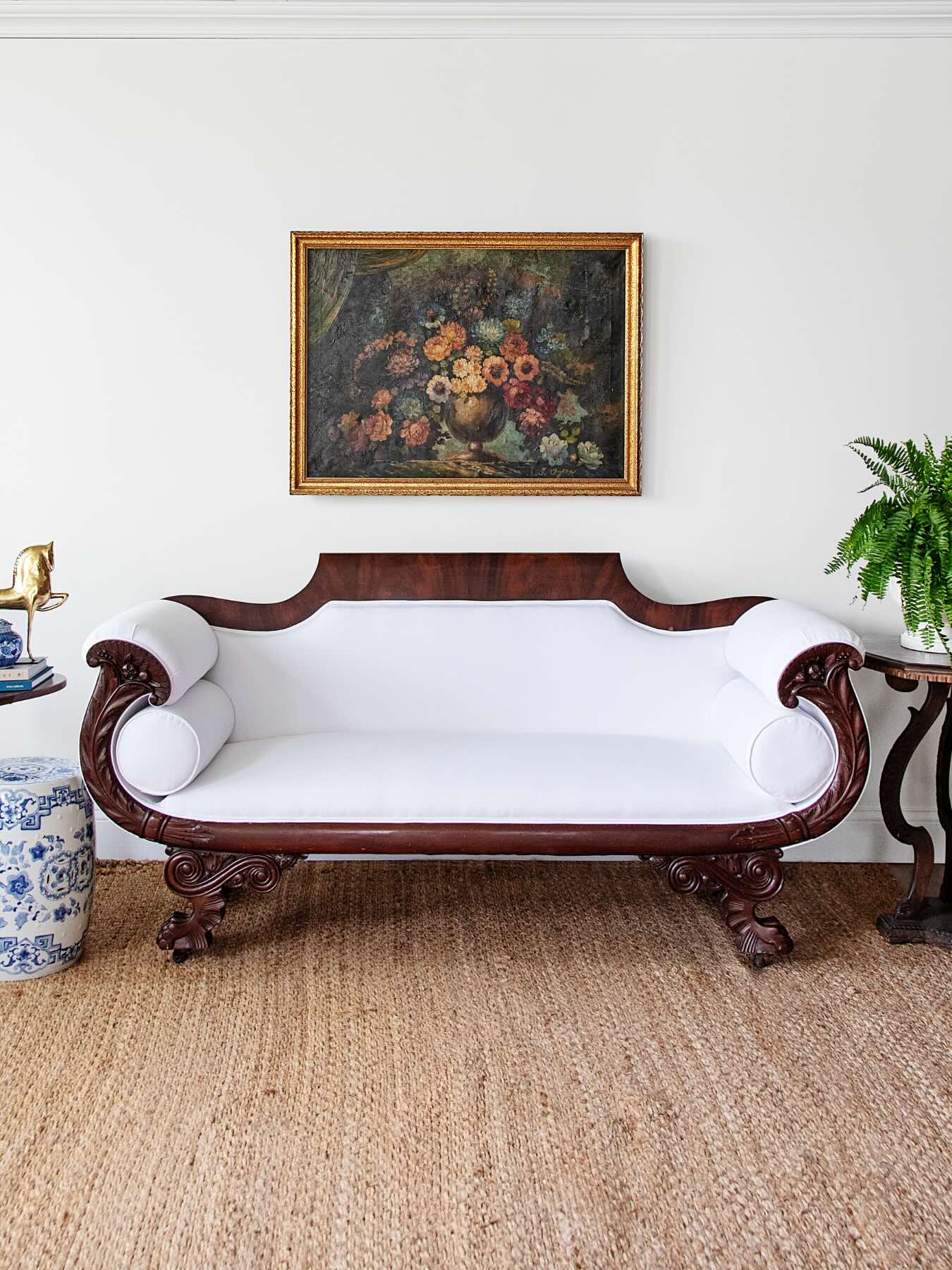Antique Carved Mahogany Sofa with Crisp White Upholstery