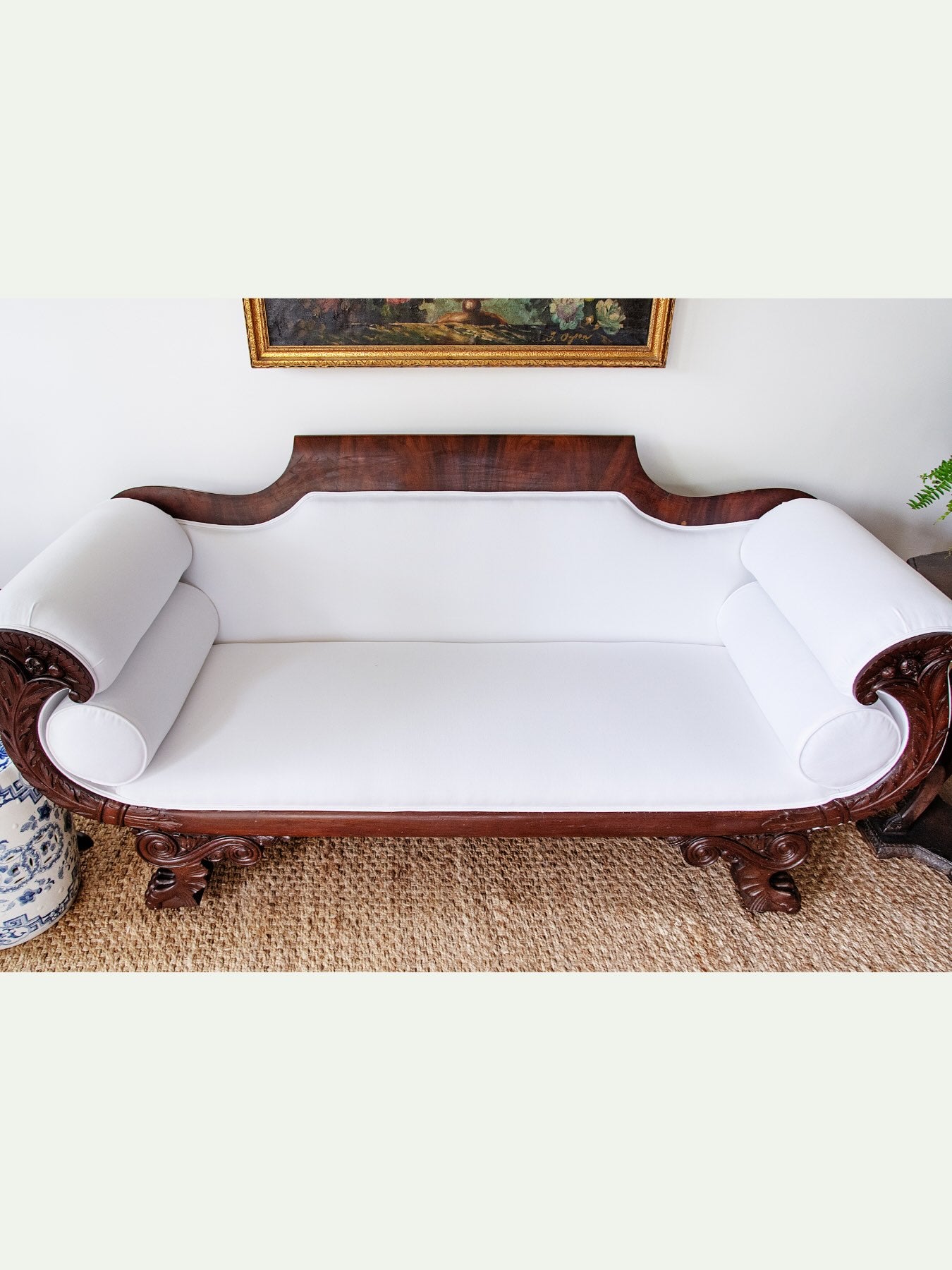 Antique Carved Mahogany Sofa with Crisp White Upholstery