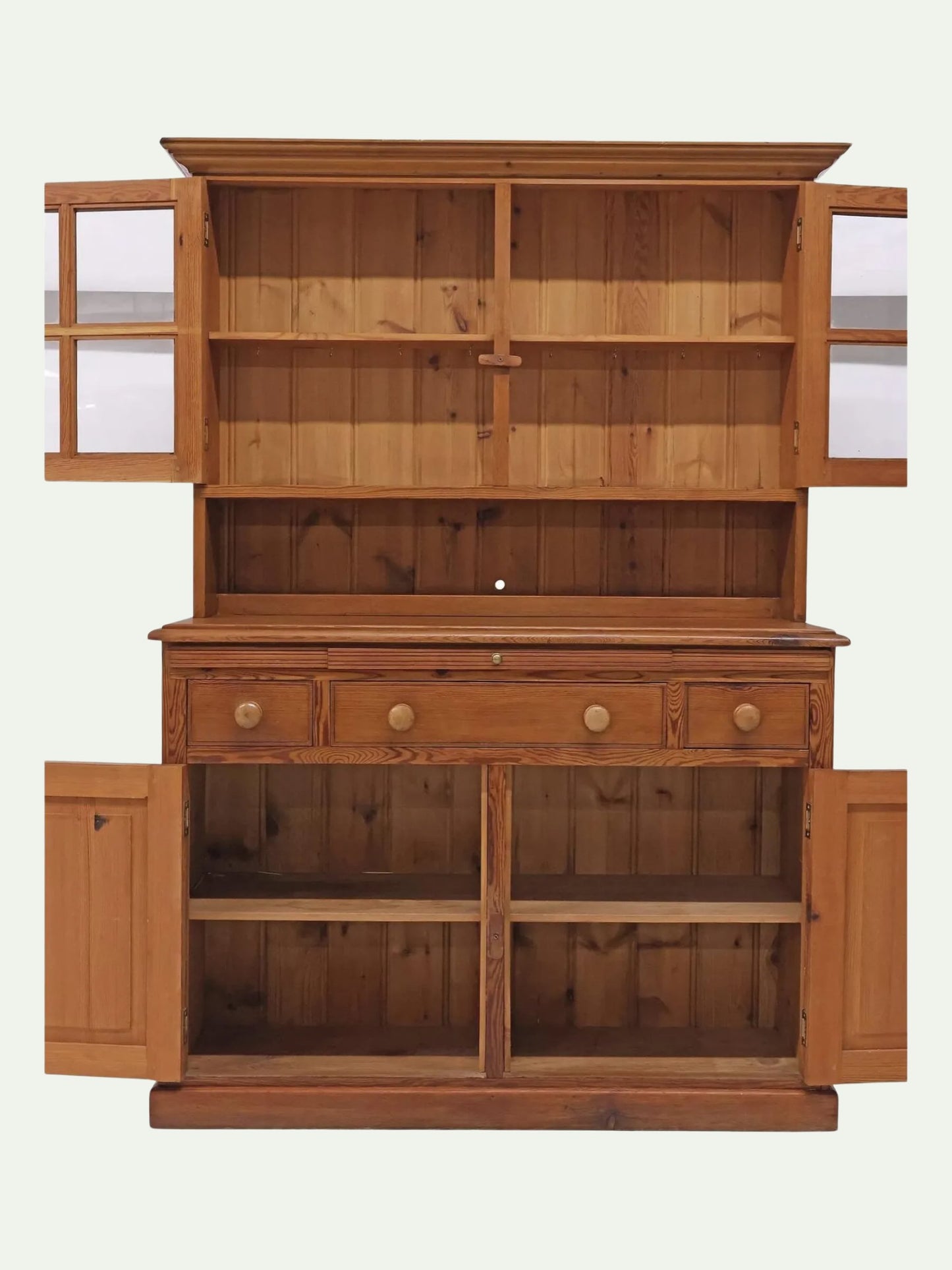 A large wooden hutch or cabinet with an open top, three drawers with round knobs, and open lower cabinet compartments, shown against a plain light background.