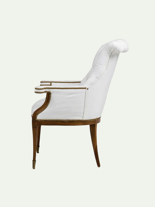White upholstered chair with wooden frame on a white background