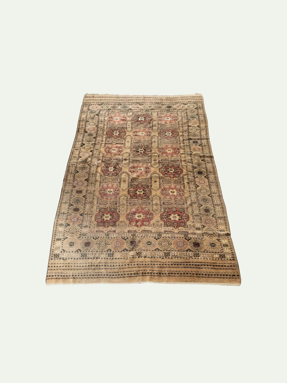 A rectangular vintage-style area rug with a traditional Persian or Turkish design, featuring a beige base with red, brown, and black patterns, shown flat against a light off-white background.