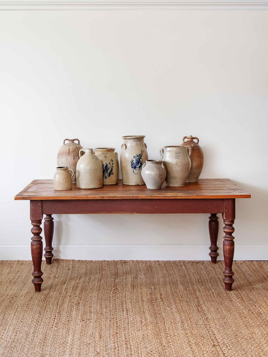 antique pine table with jars on top