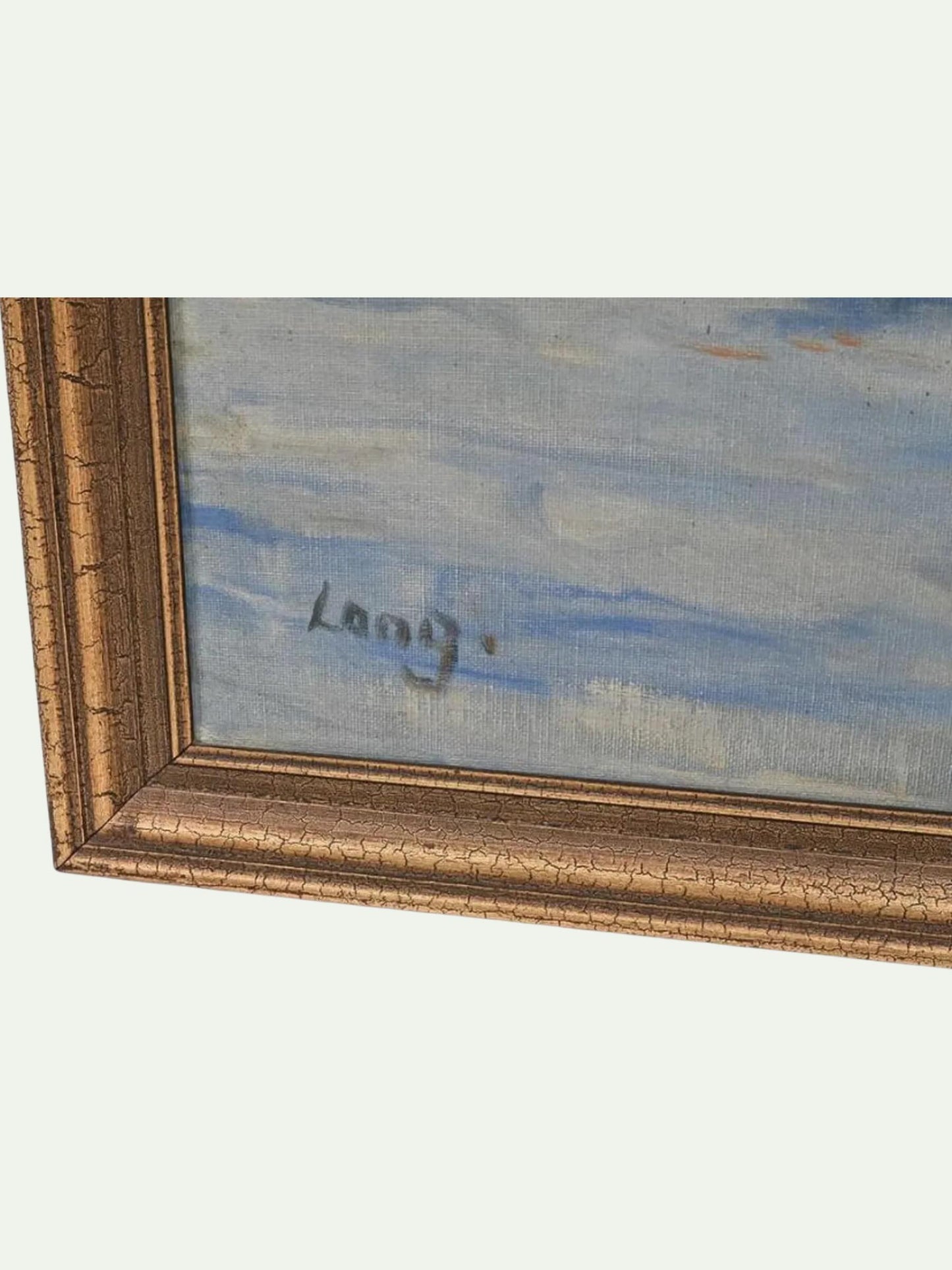 Close-up of a framed painting showing a textured gold frame, a blue and white sky-like painting, and a handwritten signature that appears to read 'Long'.
