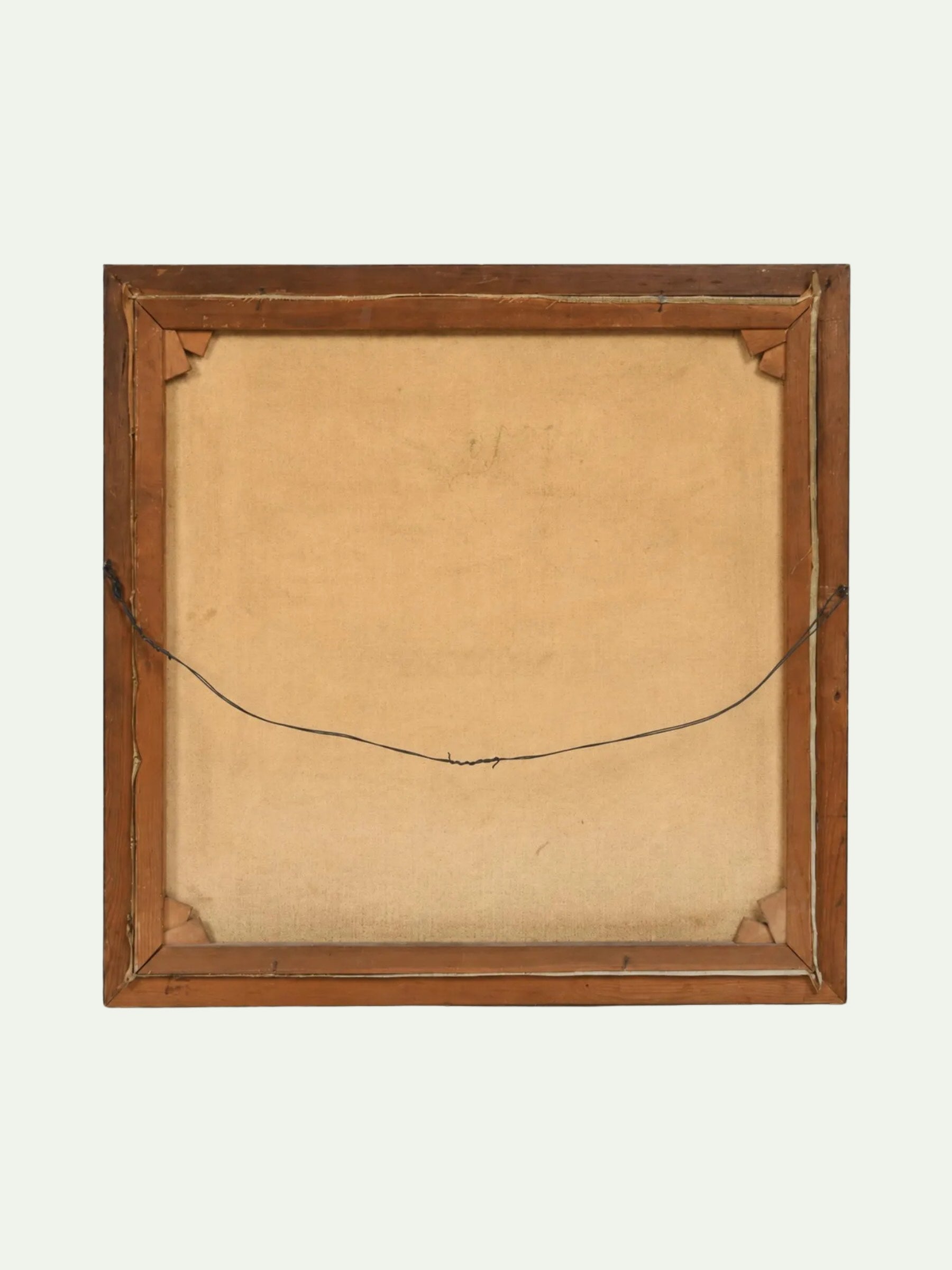 The back of a square wooden picture frame with a tan linen backing and a black hanging wire, shown against a light off-white background.