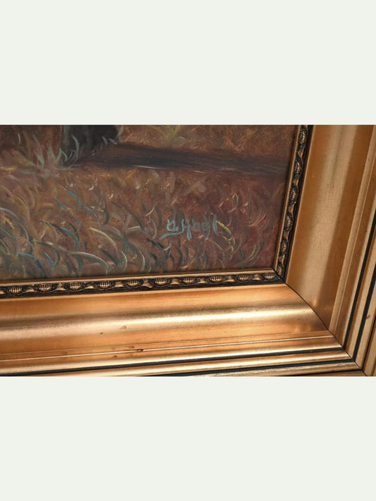 Close-up of an ornate gold picture frame with a painted scene visible inside, showing textured brushstrokes in brown, gold, and muted blue-green tones.
