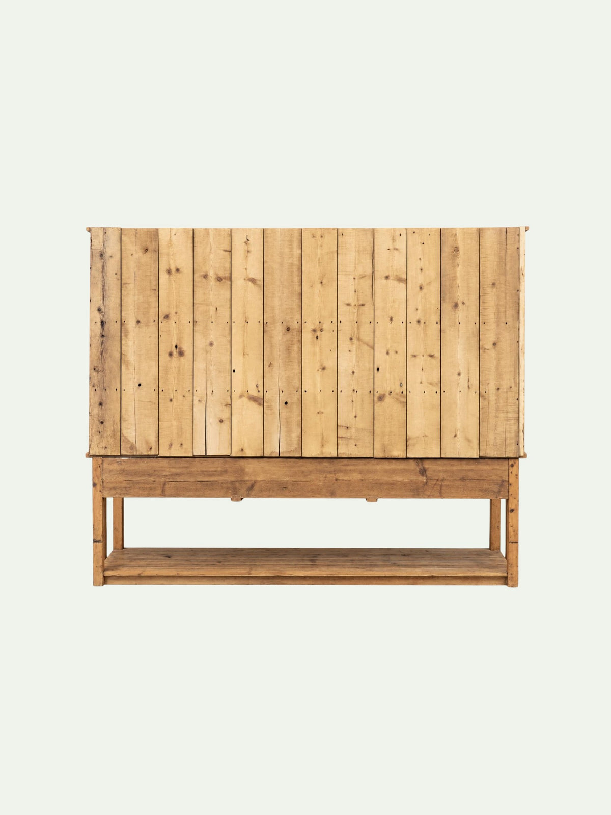 A rustic wooden storage bench or cabinet with a slatted back panel and a lower shelf, shown against a plain light background.