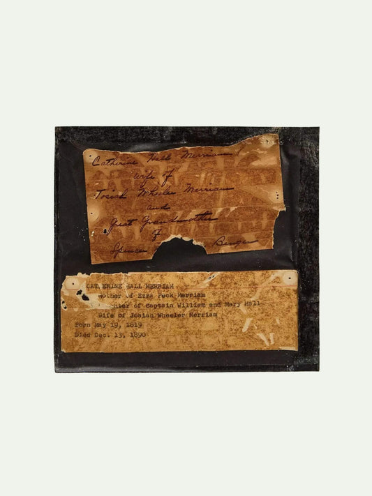 Two pieces of aged paper with text on a black background