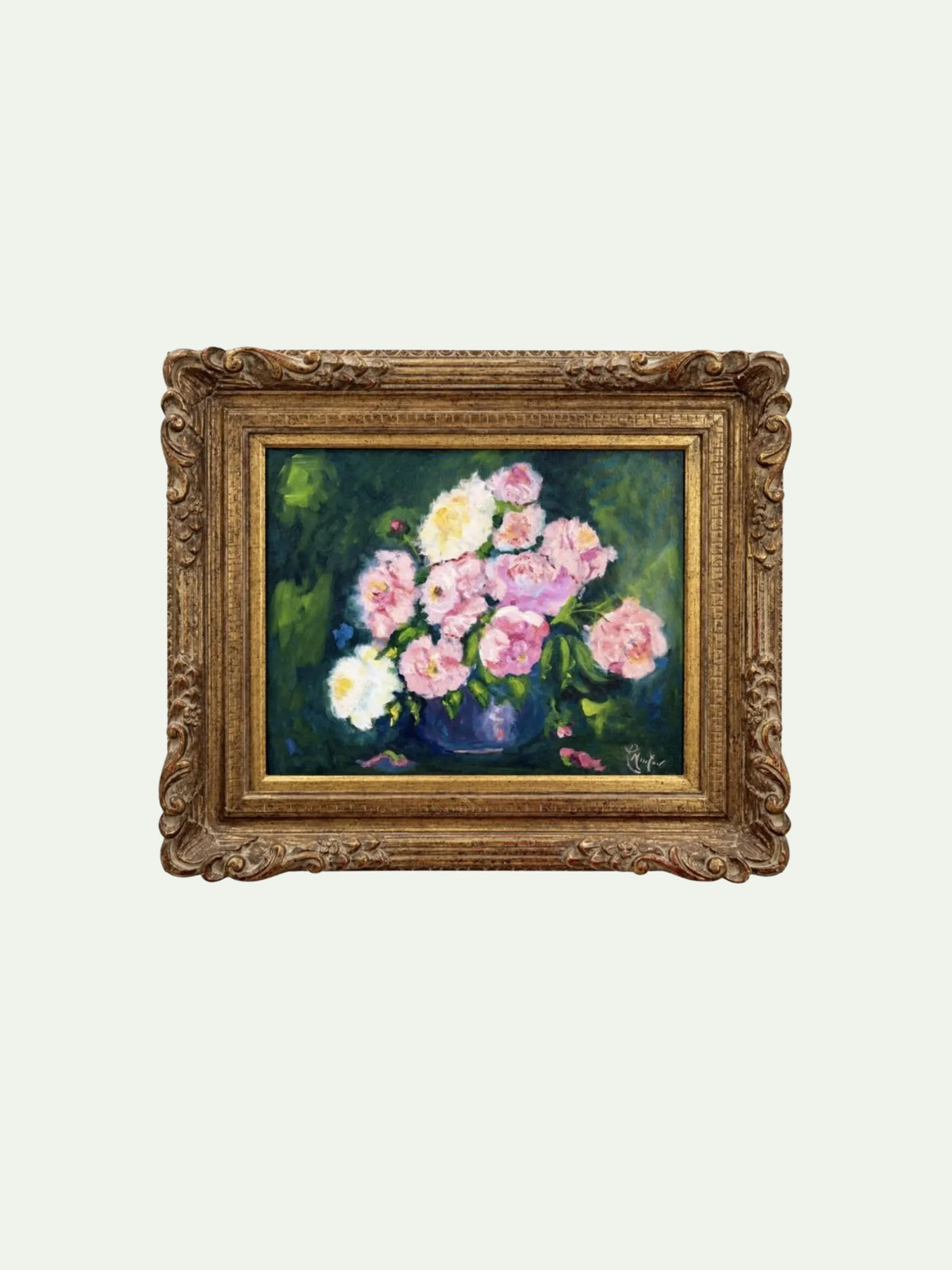 An ornate gold-framed painting depicting a bouquet of pink and white flowers in a dark green and blue vase, set against a light off-white background.