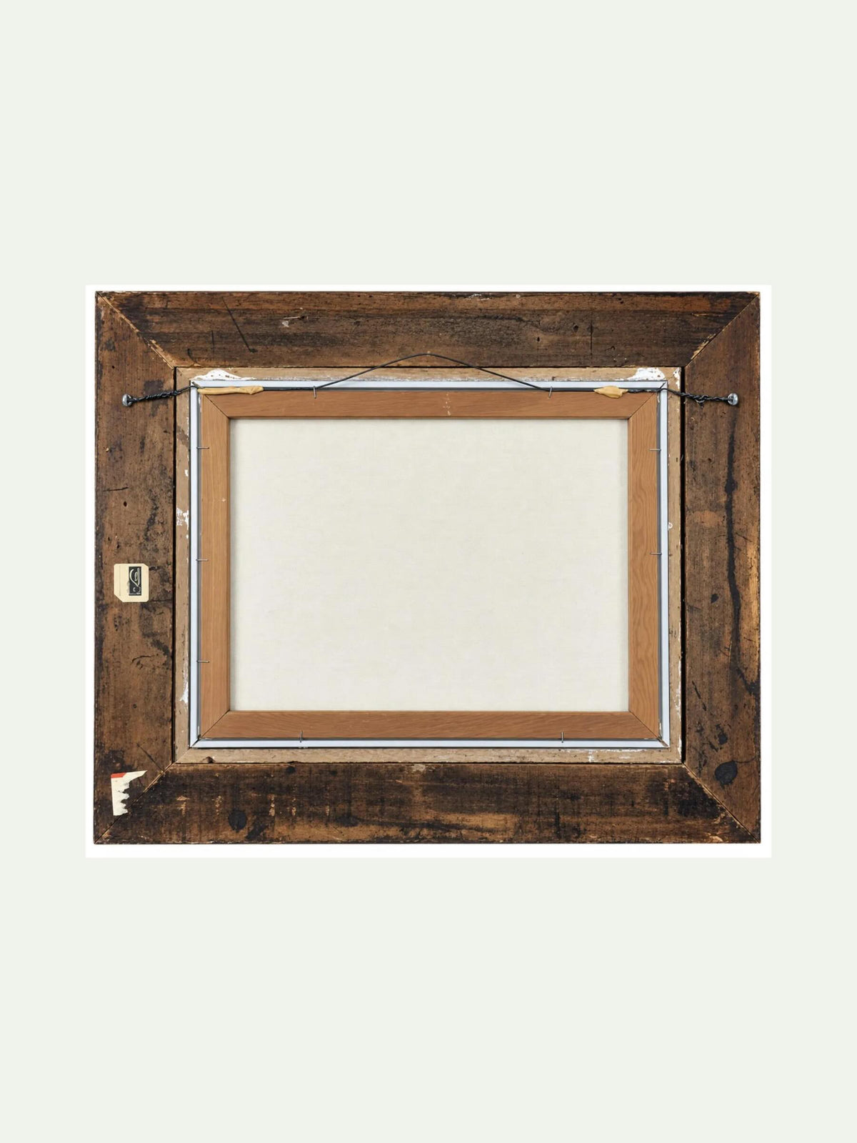 A square wooden picture frame with a rustic dark brown finish, showing the blank back side with a wire hanger attachment, set against a solid off-white background.