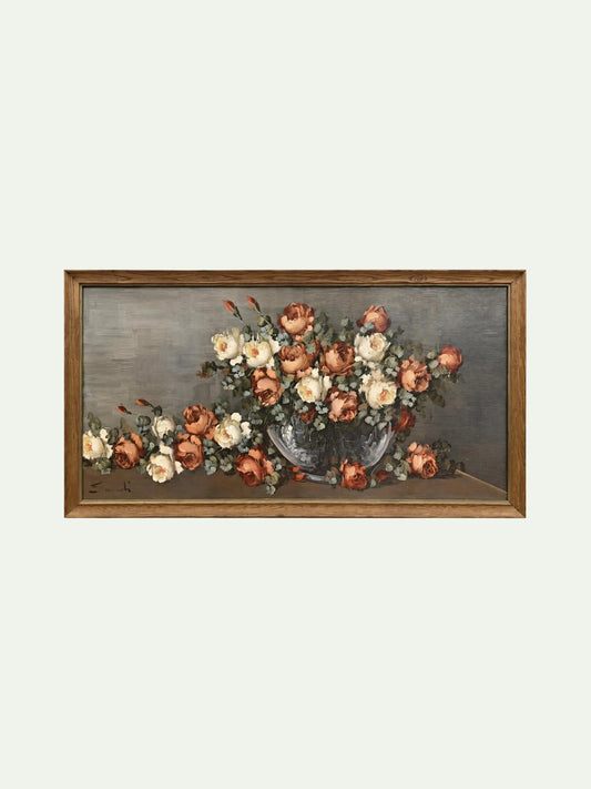 A framed still life painting featuring a bouquet of peach, cream, and white flowers in a dark vase against a muted gray background, enclosed in a brown wooden frame.