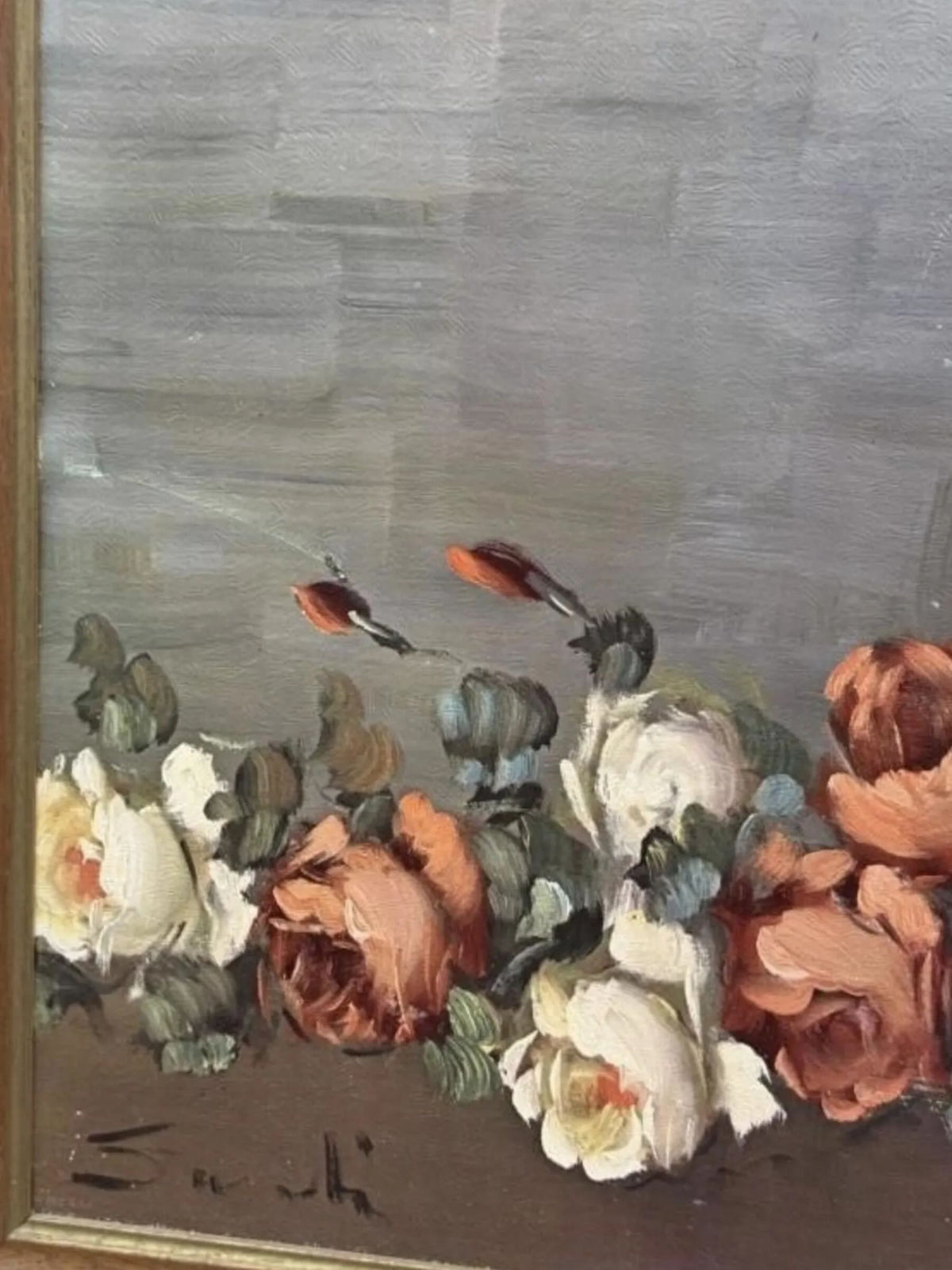 An oil painting depicting a bouquet of white and peach roses with green leaves against a textured gray background, framed by a gold-toned border.